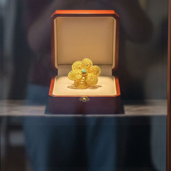 Handcrafted Gold-Tone Flower Ring with Green Accent